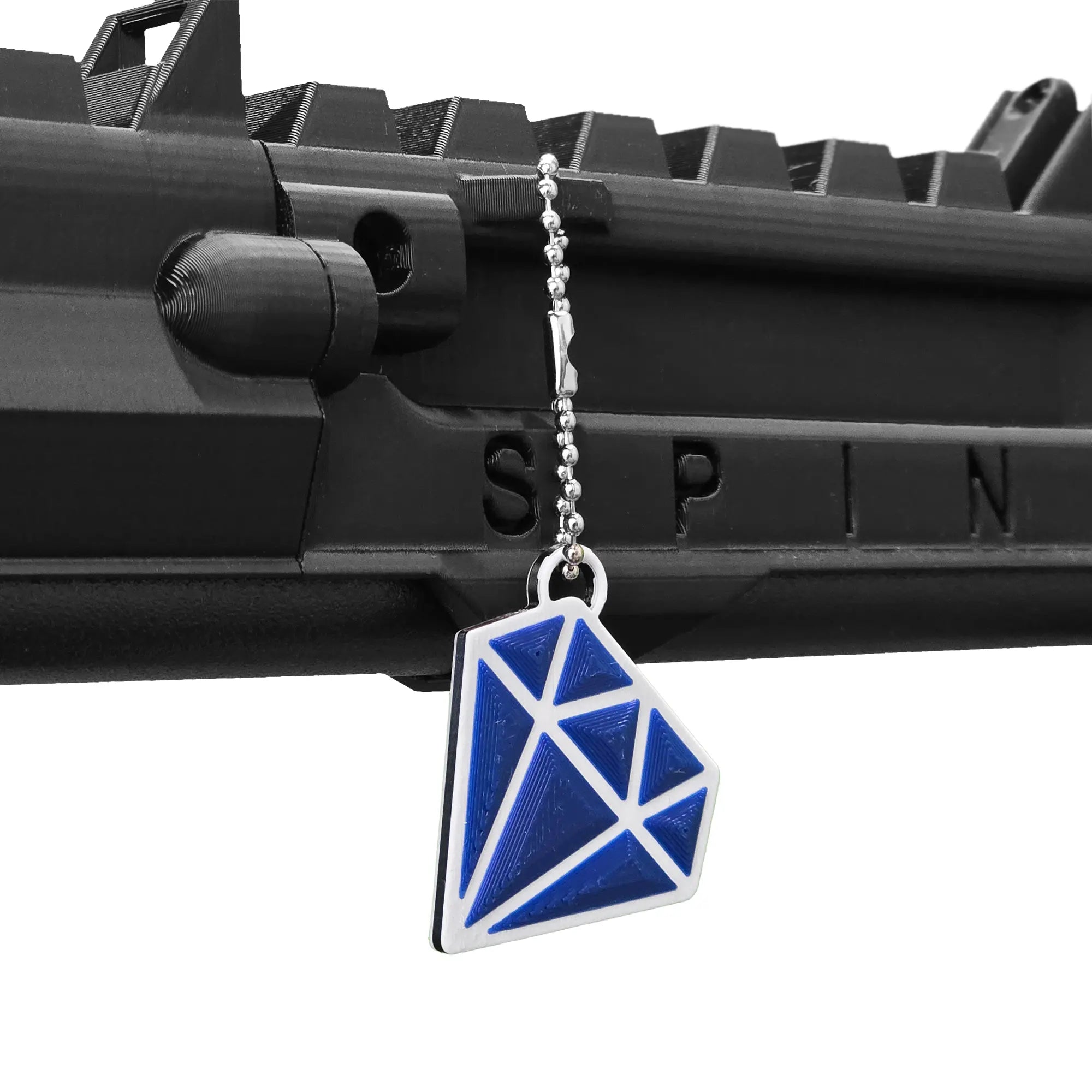Blue diamond with white outline keychain hanging from a SPINE VR Gun Stock using a ball chain