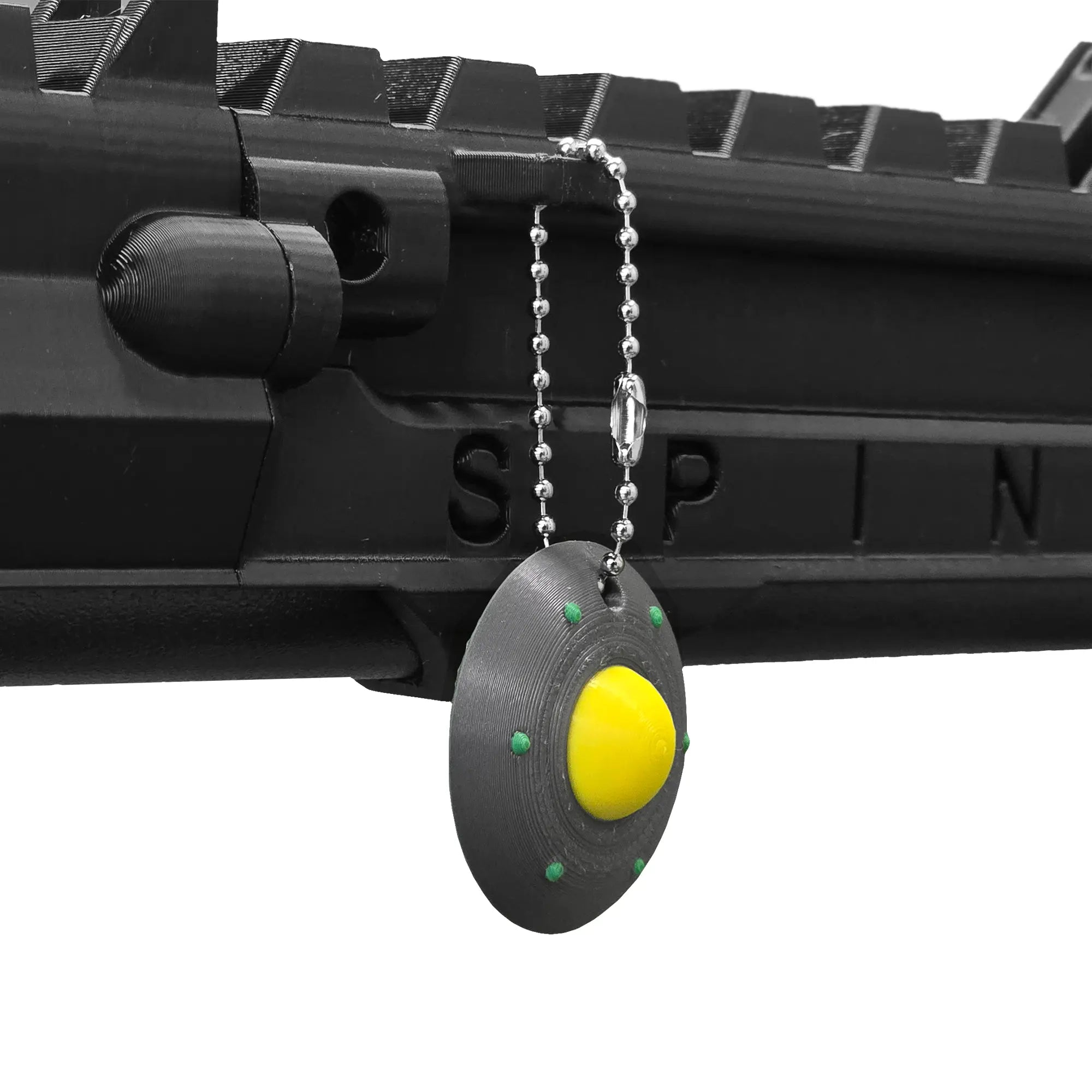 UAP keychain hanging from a SPINE VR Gun Stock using a ball chain